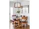 Stylish dining room featuring hardwood floors and a rustic wooden table at 4571 Beach Ct, Denver, CO 80211