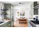Open concept kitchen with a view of the dining room at 4571 Beach Ct, Denver, CO 80211