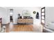 Inviting entryway with light hardwood floors and a modern storage console at 4571 Beach Ct, Denver, CO 80211