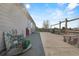 Spacious backyard patio perfect for outdoor dining and entertaining under a sunny sky at 2321 Ance St, Strasburg, CO 80136