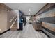 Finished basement area with stylish wood paneling, wet bar, and ample storage space at 2321 Ance St, Strasburg, CO 80136