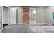 Bedroom with a carpet, barn door, and ensuite bathroom at 2321 Ance St, Strasburg, CO 80136