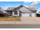 Charming single-Gathering home with a three car garage and well-maintained lawn and siding at 2321 Ance St, Strasburg, CO 80136