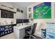 Cozy home office with baseball themed decor and a comfortable ergonomic chair at 2321 Ance St, Strasburg, CO 80136