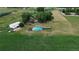 Aerial view of the farm with pool, barn, house, and fenced pasture at 620 State Highway 52, Erie, CO 80516