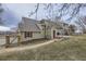 Beautiful backyard featuring a patio, mature trees, green lawn, and great outdoor space at 620 State Highway 52, Erie, CO 80516