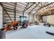 Spacious barn interior with high ceilings, ample storage, and room for tractors and equipment at 620 State Highway 52, Erie, CO 80516