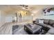 Basement featuring a large area rug, a sectional sofa and a staircase at 620 State Highway 52, Erie, CO 80516
