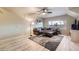 Basement area featuring a sectional sofa and a large area rug and a window at 620 State Highway 52, Erie, CO 80516