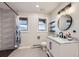 Bright bathroom with a vanity and sink, and a shower at 620 State Highway 52, Erie, CO 80516