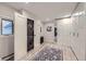 Laundry room with stackable washer/dryer, storage, and stylish decor at 620 State Highway 52, Erie, CO 80516