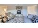 Cozy living room featuring a stone fireplace and comfortable seating at 620 State Highway 52, Erie, CO 80516