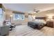Spacious main bedroom with a ceiling fan, bench, and a large window at 620 State Highway 52, Erie, CO 80516