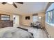 Relaxing main bedroom featuring a TV, large windows, a dresser and stylish decor at 620 State Highway 52, Erie, CO 80516