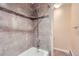 Modern shower with tiled walls, a showerhead, and a built-in shelf at 620 State Highway 52, Erie, CO 80516