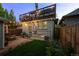 Charming backyard featuring a patio, small lawn, and string lights at 3354 Vallejo St, Denver, CO 80211