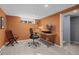Basement office features a modern desk setup, comfortable seating, and natural light from a window at 3354 Vallejo St, Denver, CO 80211