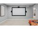 Finished basement features a large projector screen, perfect for movie nights at 3354 Vallejo St, Denver, CO 80211