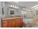 Bathroom featuring a double vanity, soaking tub, and walk-in shower at 3354 Vallejo St, Denver, CO 80211