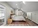 Bright bedroom features hardwood floors, a large bed, and custom closet space along an accent wall at 3354 Vallejo St, Denver, CO 80211