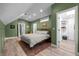 Bright bedroom boasts hardwood floors, ample natural light, and access to walk-in closet at 3354 Vallejo St, Denver, CO 80211