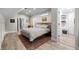 Bedroom with natural light, hardwood floors, a bed, and access to the walk-in closet at 3354 Vallejo St, Denver, CO 80211