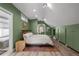 Tranquil bedroom featuring wood floors, natural light, ensuite bath, and built-in storage at 3354 Vallejo St, Denver, CO 80211