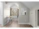 Bright bedroom features hardwood floors, a work desk, and custom closet space along an accent wall at 3354 Vallejo St, Denver, CO 80211