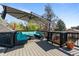 Spacious deck with a large outdoor sofa and awning at 3354 Vallejo St, Denver, CO 80211