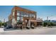 Modern building with wood paneling, large windows, outdoor patio and street front access at 3354 Vallejo St, Denver, CO 80211