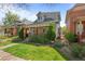 Charming two-story home featuring a stone facade, landscaped front yard, and inviting covered porch at 3354 Vallejo St, Denver, CO 80211