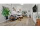 Comfortable living room featuring a gray sectional sofa, stylish decor, and natural light from a window at 3354 Vallejo St, Denver, CO 80211