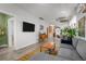 Bright living room with a comfortable gray sectional sofa, a vintage cabinet, and an open layout at 3354 Vallejo St, Denver, CO 80211