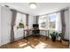 Inviting office space featuring hardwood floors, large windows, and neutral decor at 3354 Vallejo St, Denver, CO 80211
