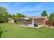 Spacious backyard featuring a well-manicured lawn, concrete patio, and garden area at 6180 W 77Th Pl, Arvada, CO 80003