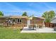 Cozy backyard patio with outdoor seating and a landscaped garden area at 6180 W 77Th Pl, Arvada, CO 80003