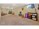 Expansive finished basement area features plush carpeting, recessed lighting, and ample space for recreation at 6180 W 77Th Pl, Arvada, CO 80003