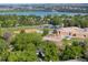 High angle aerial view reveals lake and ball field next to the local school and neighborhood at 7695 S Harlan St, Littleton, CO 80128