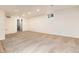 Unfinished basement area with neutral carpet and recessed lighting, ready for customization at 7695 S Harlan St, Littleton, CO 80128
