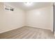 Carpeted basement room with natural light, perfect for a bedroom or home office at 7695 S Harlan St, Littleton, CO 80128