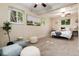 Bright and inviting bedroom with neutral decor, a ceiling fan, and natural light at 7695 S Harlan St, Littleton, CO 80128