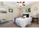 Inviting bedroom with plush carpet, ample natural light, and a comfortable bed at 7695 S Harlan St, Littleton, CO 80128