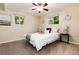 Cozy bedroom with neutral walls, ceiling fan, and bright windows at 7695 S Harlan St, Littleton, CO 80128