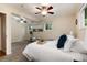 Cozy bedroom features carpeted floors, natural light, and ceiling fans for a relaxing atmosphere at 7695 S Harlan St, Littleton, CO 80128
