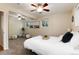 Spacious main bedroom with two windows, ceiling fan, and a cozy feel at 7695 S Harlan St, Littleton, CO 80128