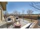 Outdoor living on this patio with furniture, fire pit and eating area at 1960 E 166Th Dr, Thornton, CO 80602