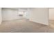 Unfinished basement features neutral carpet, neutral paint and two doors at 1960 E 166Th Dr, Thornton, CO 80602