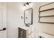 Charming bathroom features modern vanity, framed mirror and decorative shelving at 1960 E 166Th Dr, Thornton, CO 80602