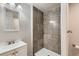 Bathroom features a tiled shower, white sink and vanity and a window at 1960 E 166Th Dr, Thornton, CO 80602