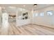 Bright living room boasts wood floors and open layout, perfect for entertaining and relaxing at 1960 E 166Th Dr, Thornton, CO 80602